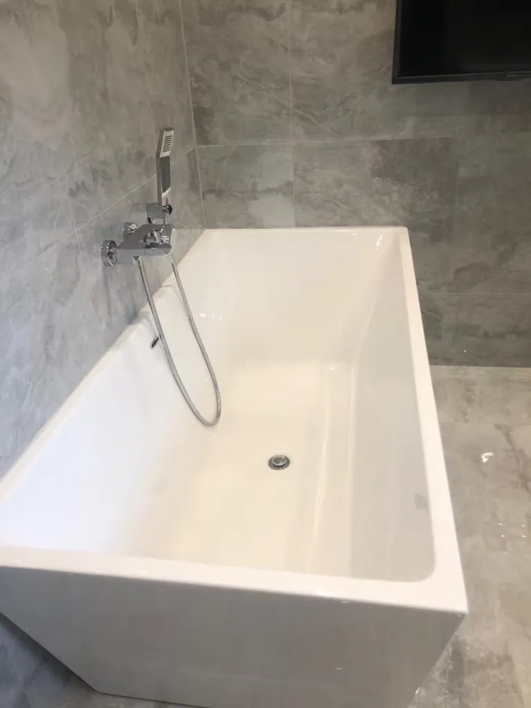 Freestanding bath in a contemporary bathroom fitted by Durham Trade Bathrooms
