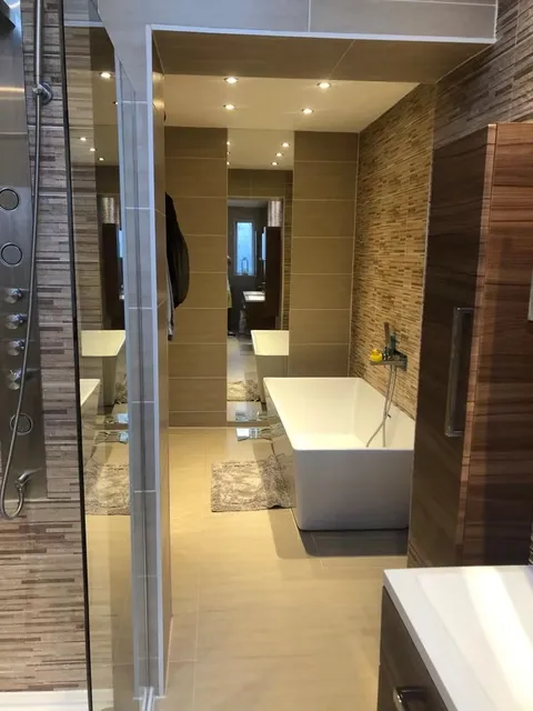 Luxury bathroom with double vanity and large format tiles
