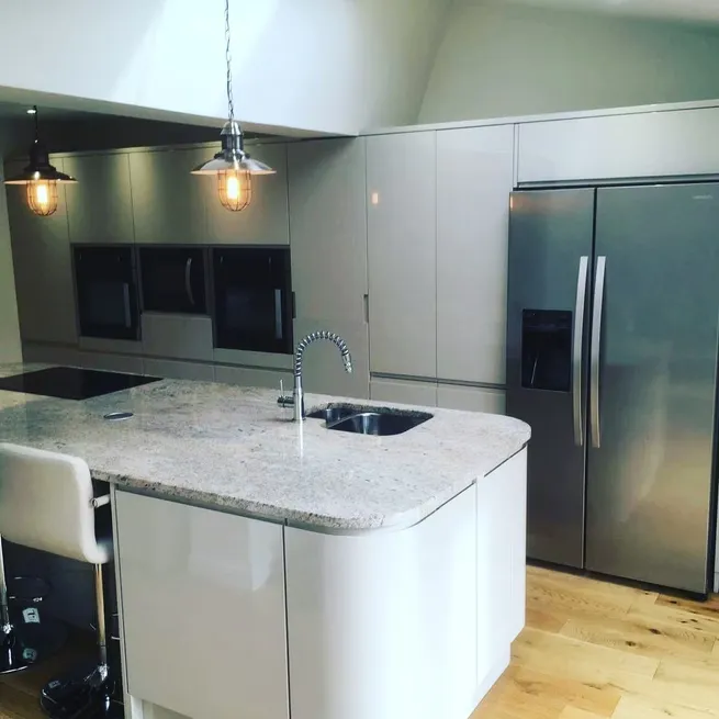 Modern fitted kitchen with a central island, installed by Durham Trade Bathrooms
